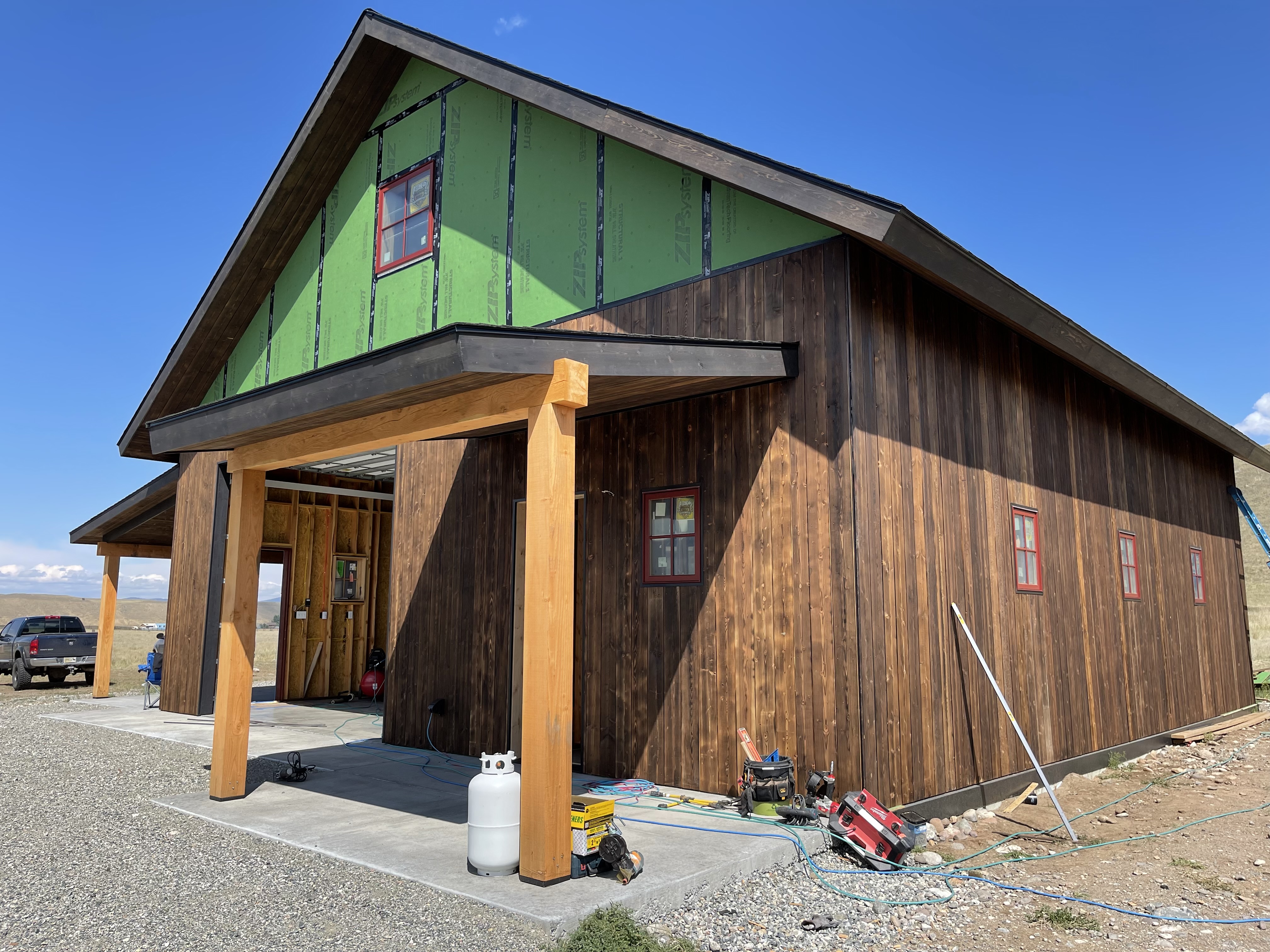 A large wooden building with a green roof