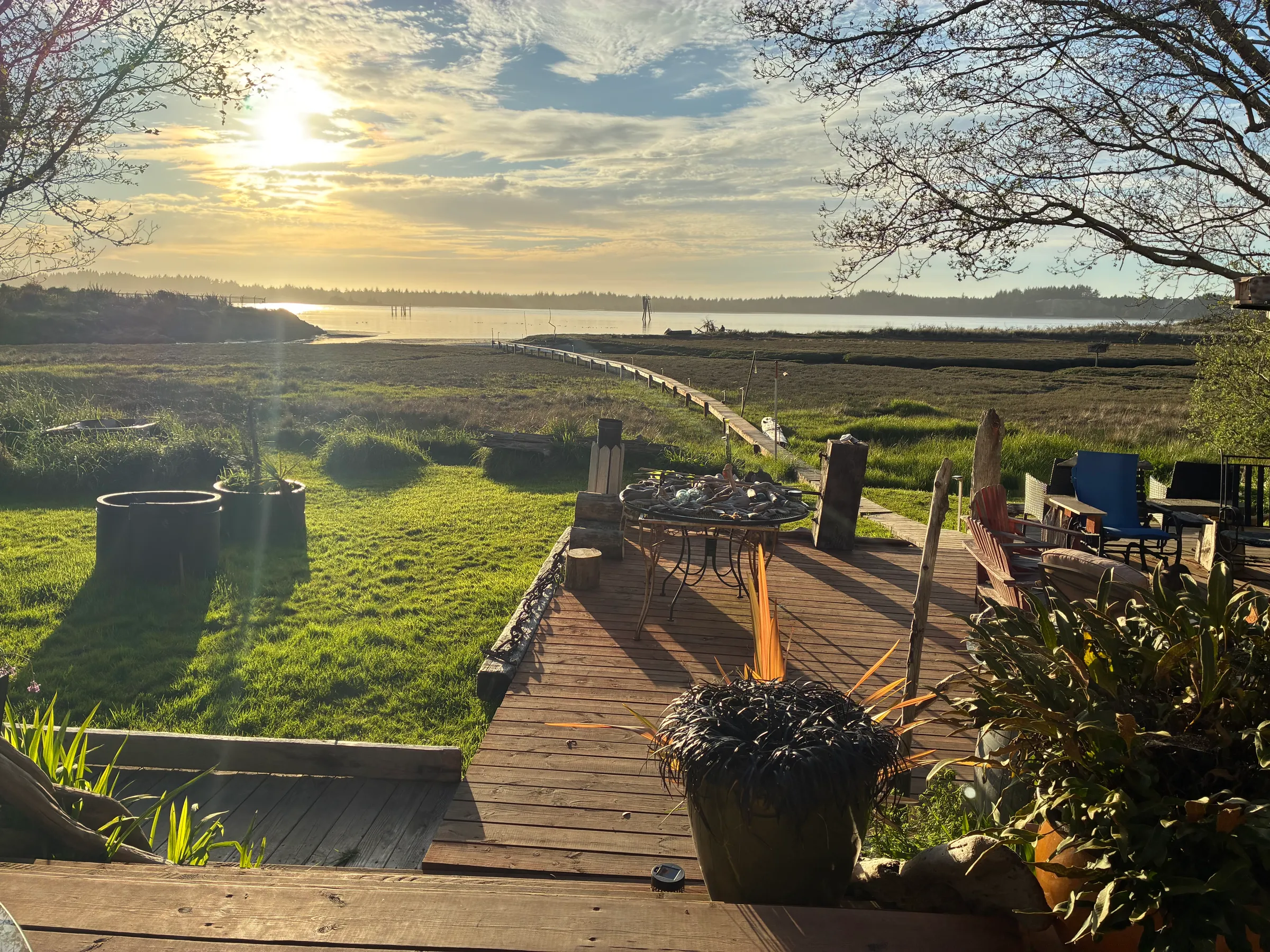 Coastal deck overlooking waterfront at sunset