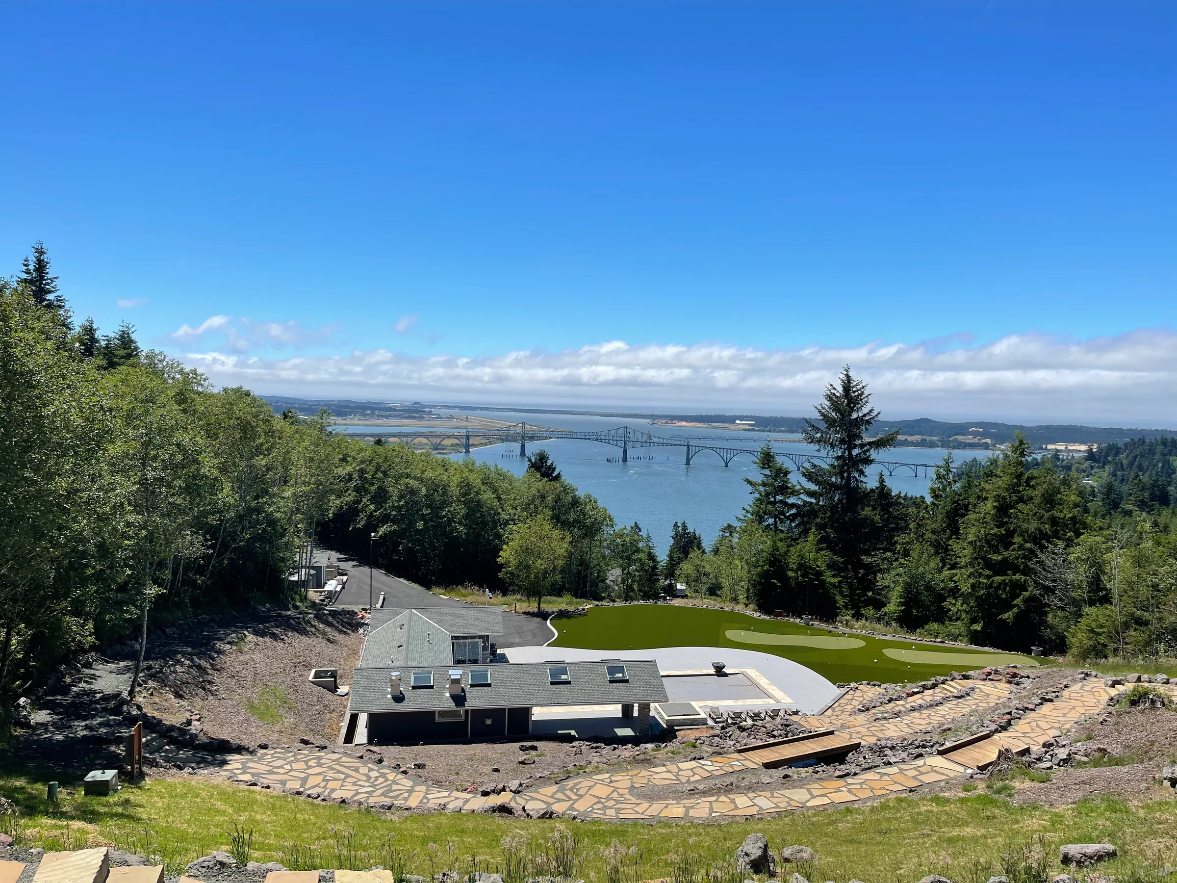 Aerial view of custom home with pool overlooking the Oregon coast